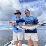 Angler holding a large cobia caught on a charter at Econfina River State Park